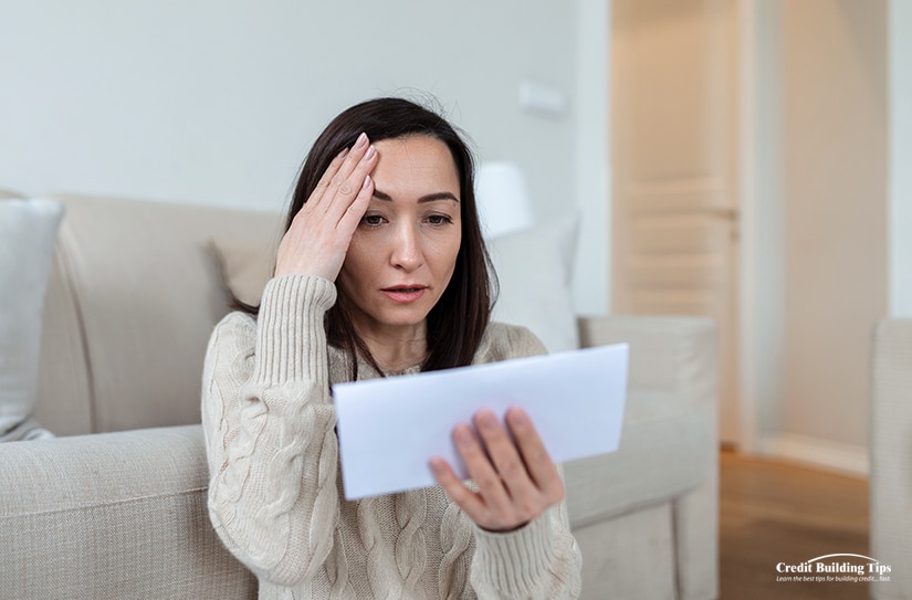 Woman Reviewing Lowered Credit Score