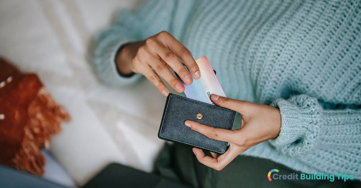 woman putting credit card in wallet after signing with the best pen