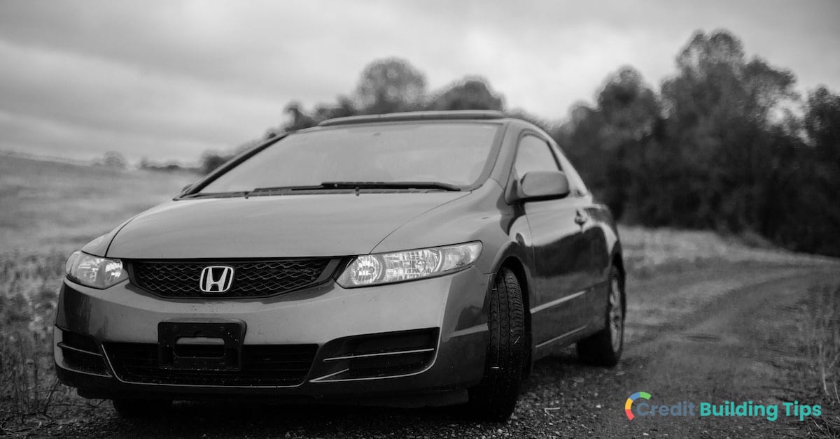 black and white photo of honda financed with minimum credit score