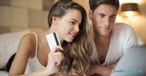 couple paying the cost of credit repair services