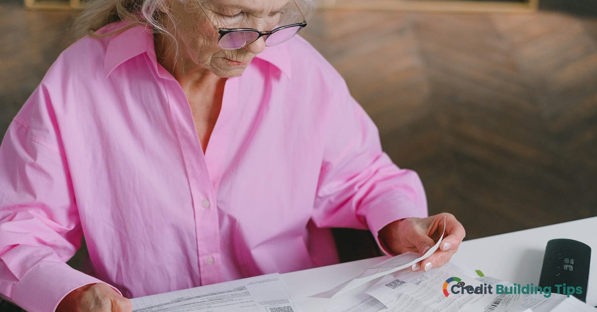 elderly woman looking at credit card offer before shredding