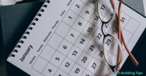 calendar with glasses to plan out credit card debt payments
